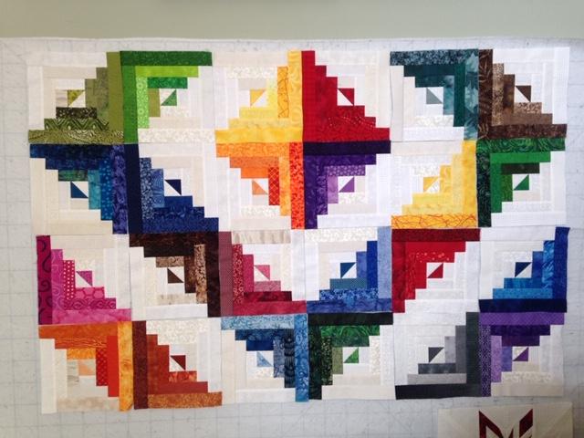 Carol Renfrew's first quilt is Bonnie Hunt's “Log Cabin Love,”