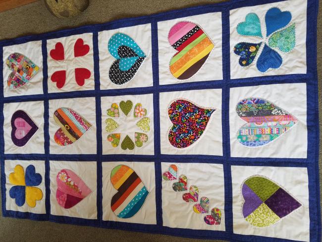 Lisia Barron's quilt is a quilt of comfort for a friend who has gotten cancer for a second time.  Her and some of the ladies in her other quilt group have all contributed to it.